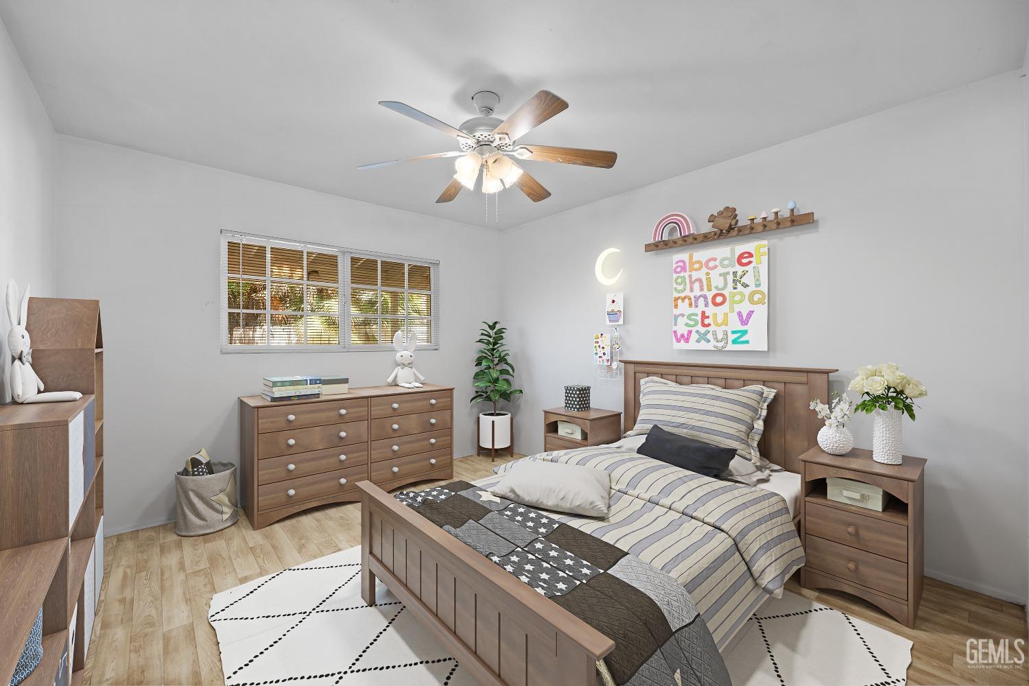 Undisclosed Address Bakersfield, CA 93309 - Photo 15 of 32 a bedroom with a bed and furniture