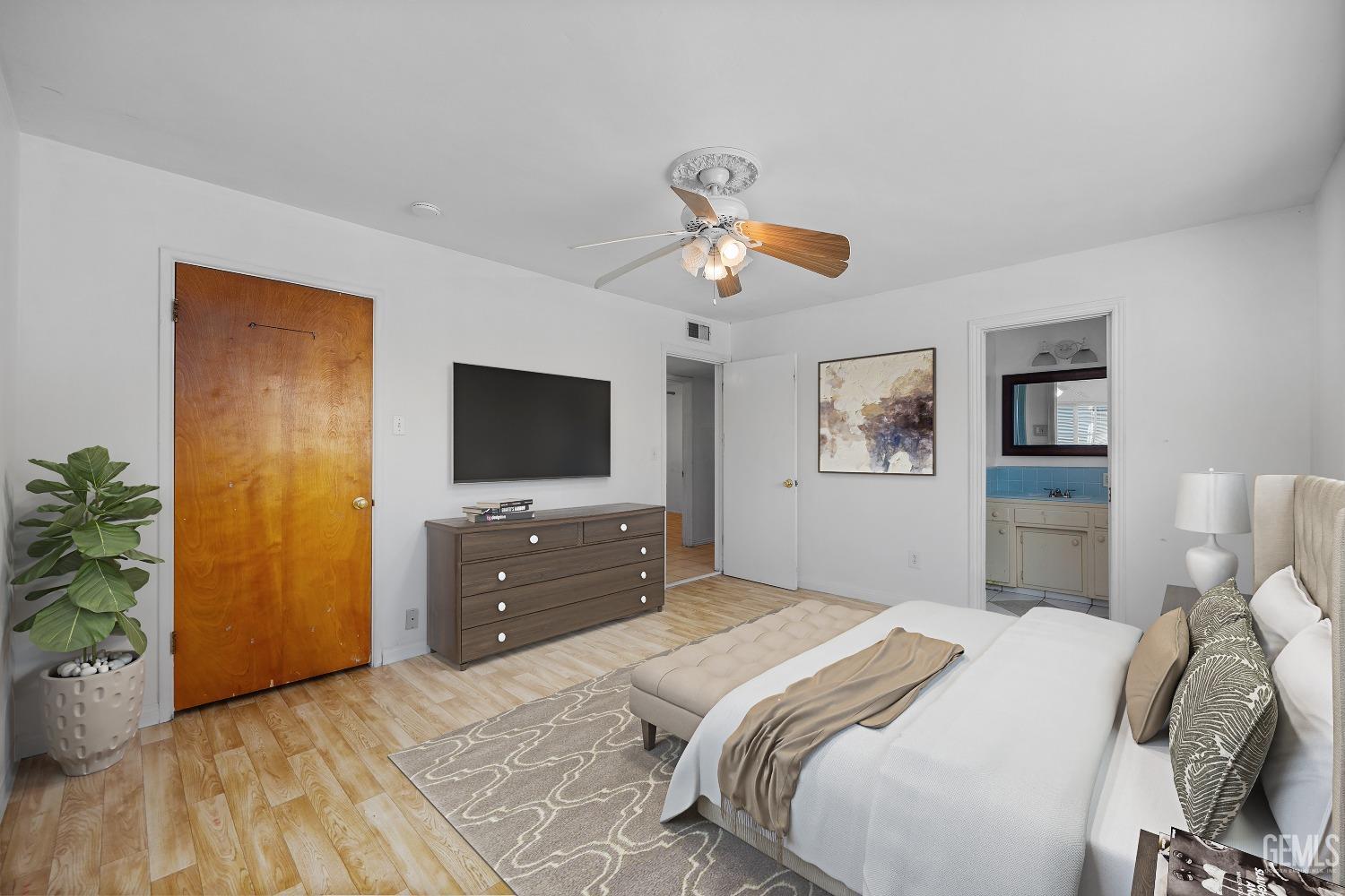 Undisclosed Address Bakersfield, CA 93309 - Photo 16 of 32 a bedroom with a bed and a flat screen tv