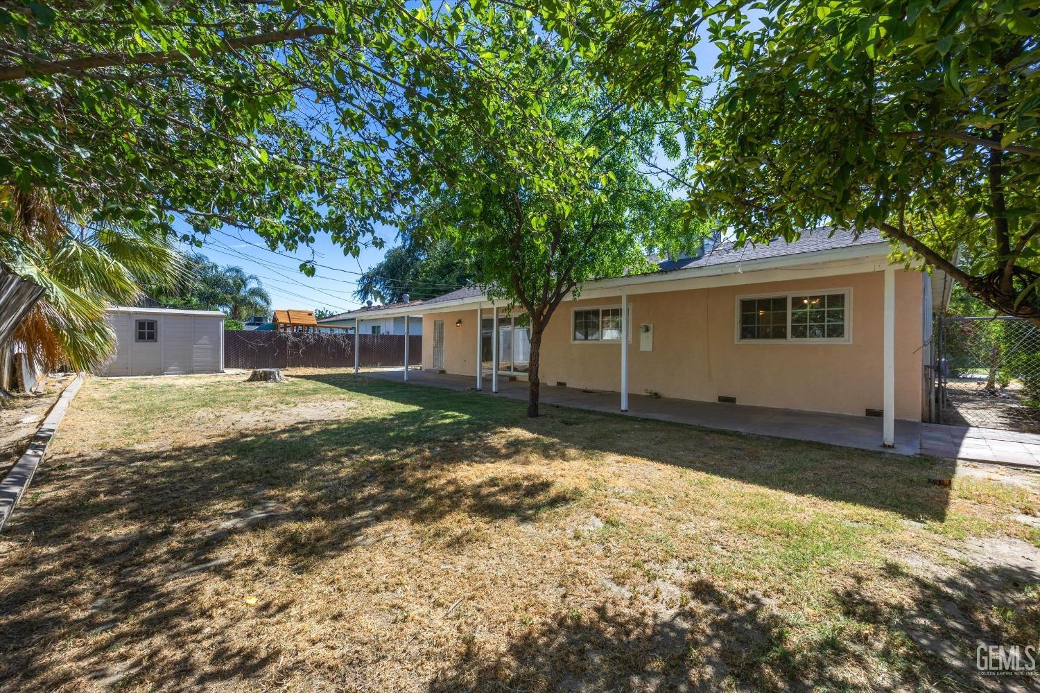 Undisclosed Address Bakersfield, CA 93309 - Photo 21 of 32 a view of a house with a yard