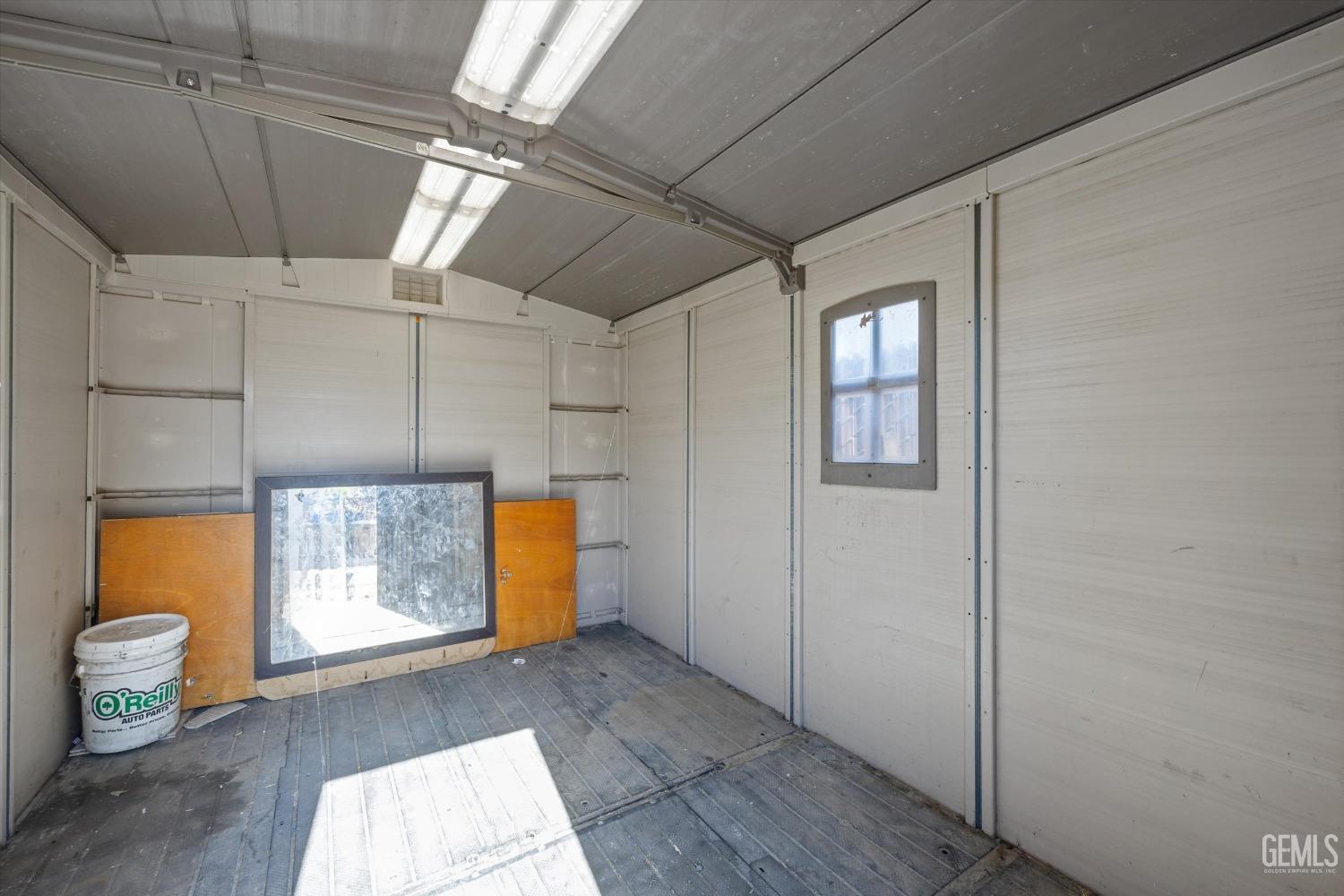 Undisclosed Address Bakersfield, CA 93309 - Photo 24 of 32 a view of an empty room with wooden floor and a window