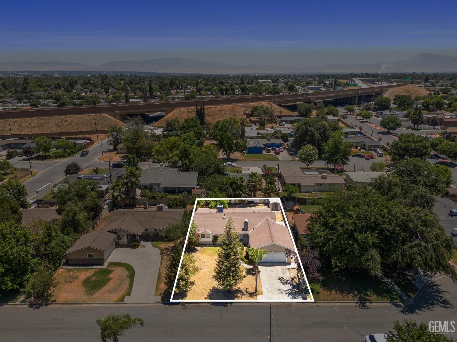 Undisclosed Address Bakersfield, CA 93309 - Photo 25 of 32 an aerial view of residential houses with outdoor space
