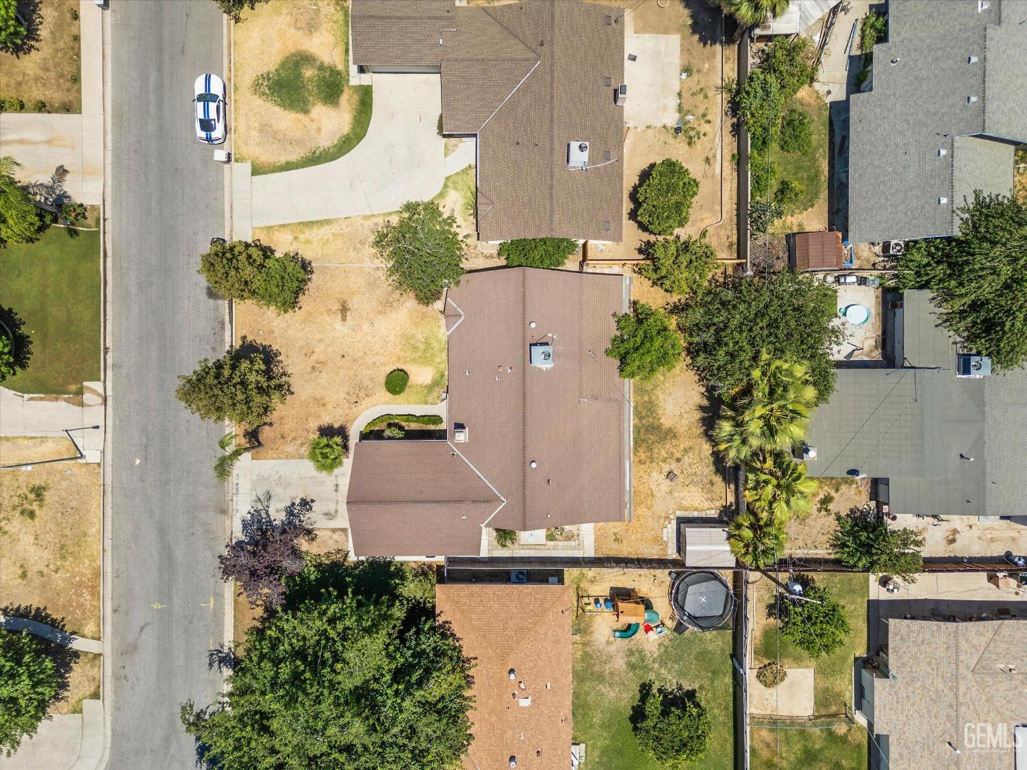 Undisclosed Address Bakersfield, CA 93309 - Photo 29 of 32 an aerial view of a house with a yard and a fountain