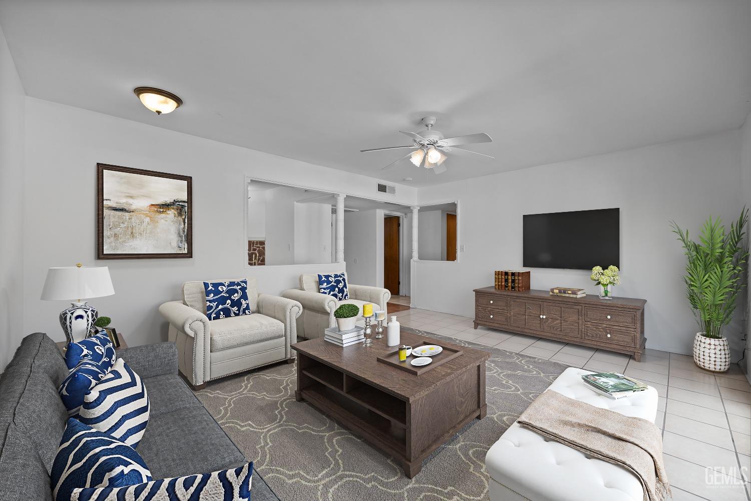 Undisclosed Address Bakersfield, CA 93309 - Photo 4 of 32 a living room with furniture or couch and a flat screen tv