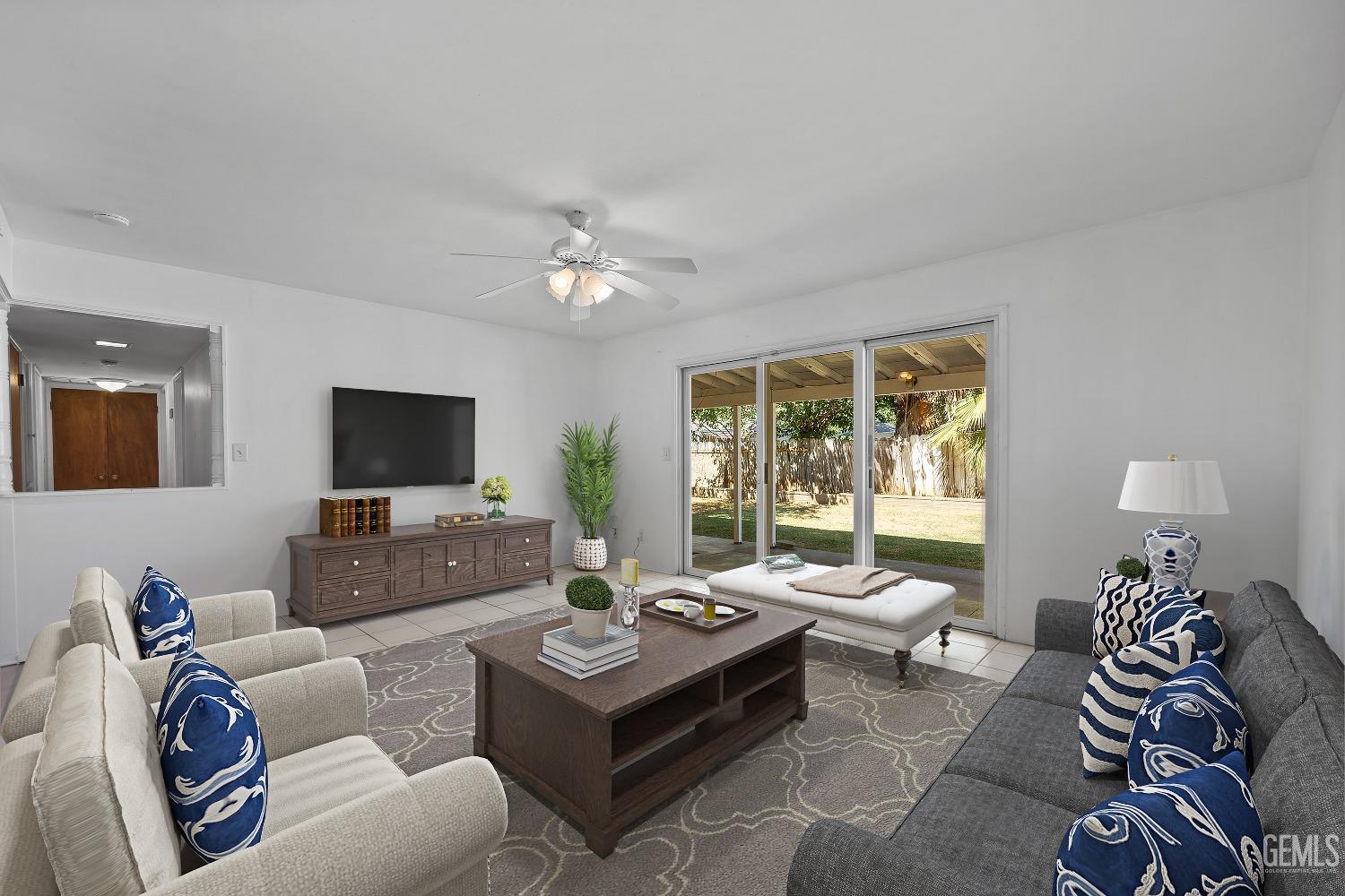 Undisclosed Address Bakersfield, CA 93309 - Photo 5 of 32 a living room with furniture and a flat screen tv