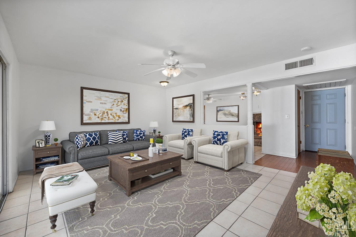 Undisclosed Address Bakersfield, CA 93309 - Photo 6 of 32 a living room with furniture and a chandelier