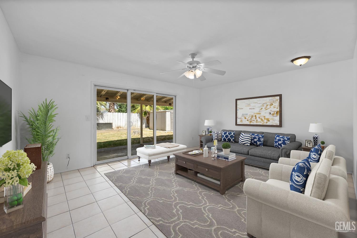 Undisclosed Address Bakersfield, CA 93309 - Photo 7 of 32 a living room with furniture and a large window