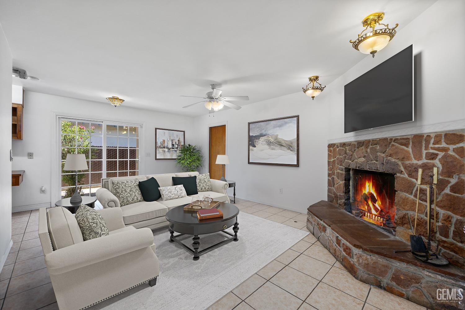 Undisclosed Address Bakersfield, CA 93309 - Photo 10 of 32 a living room with furniture and a fireplace