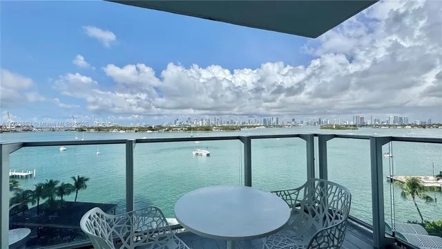 a view of a balcony with furniture