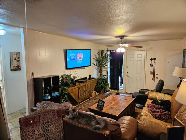 a bedroom with table and chairs