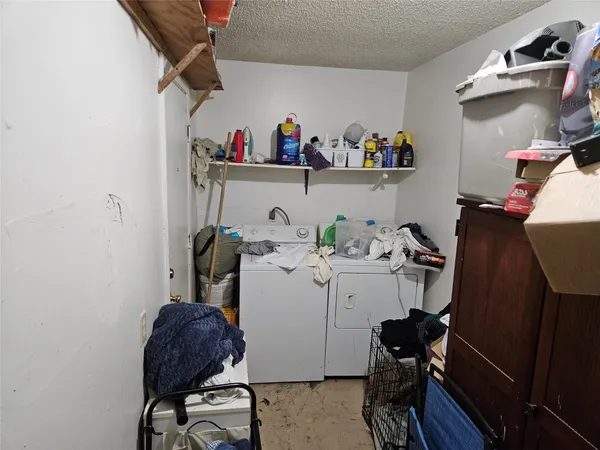 a bathroom with a granite countertop sink toilet and a mirror