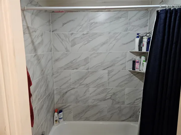 a room with furniture and a flat screen tv