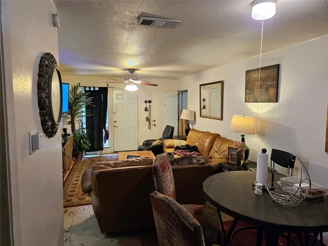 a bedroom with a bed and a mirror