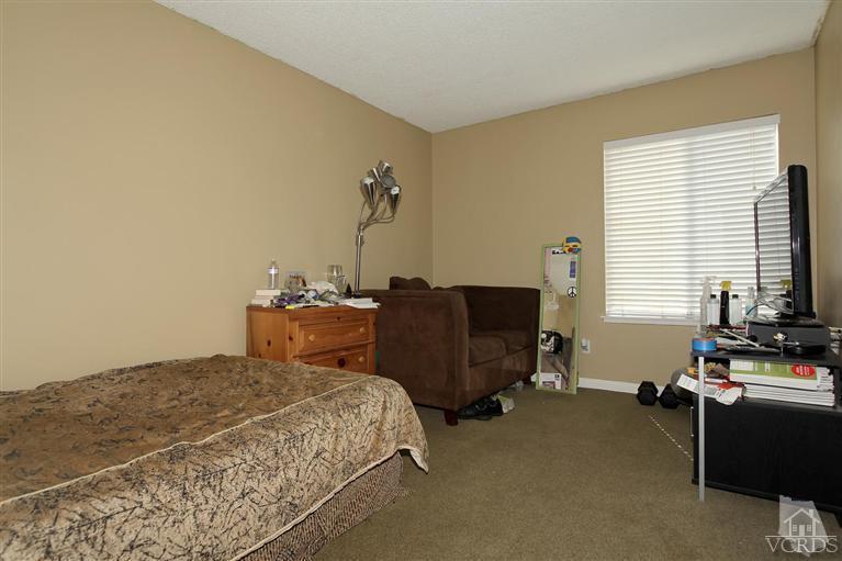4757 Avedon Road Moorpark, CA 93021 - Photo 11 of 22 a bedroom with a bed and wooden floor