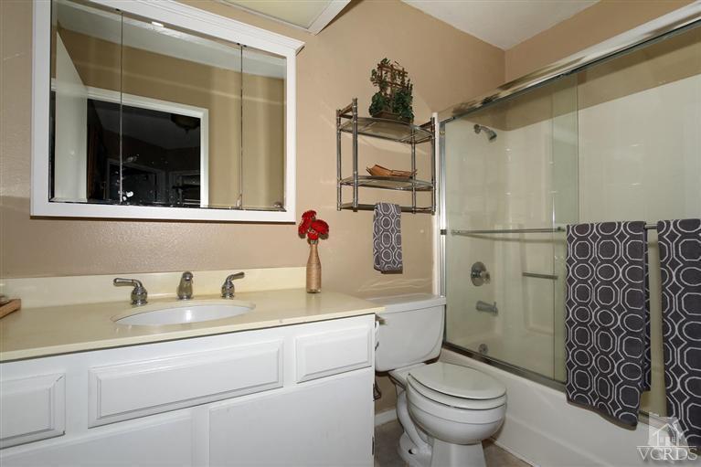 4757 Avedon Road Moorpark, CA 93021 - Photo 14 of 22 a bathroom with a sink toilet and shower