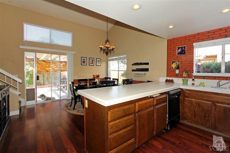 4757 Avedon Road Moorpark, CA 93021 - Photo 16 of 22 a kitchen with a sink appliances wooden floor and a large window