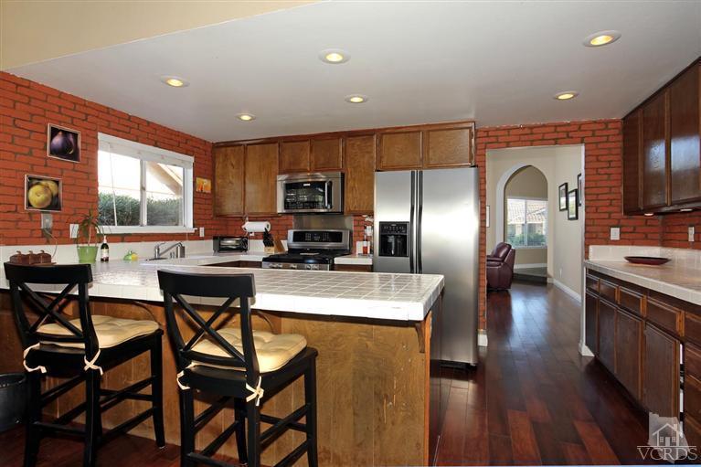 4757 Avedon Road Moorpark, CA 93021 - Photo 17 of 22 a large kitchen with a table and chairs