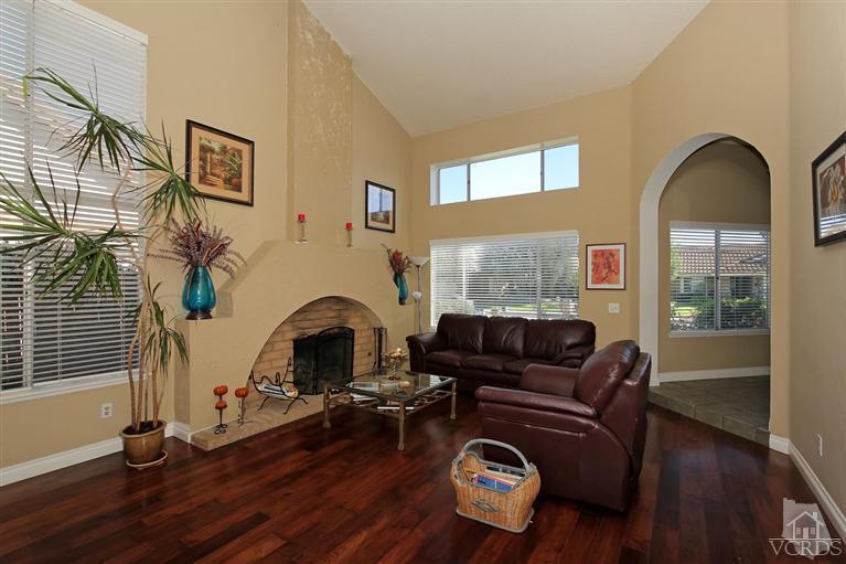4757 Avedon Road Moorpark, CA 93021 - Photo 5 of 22 a living room with furniture fireplace and wooden floor