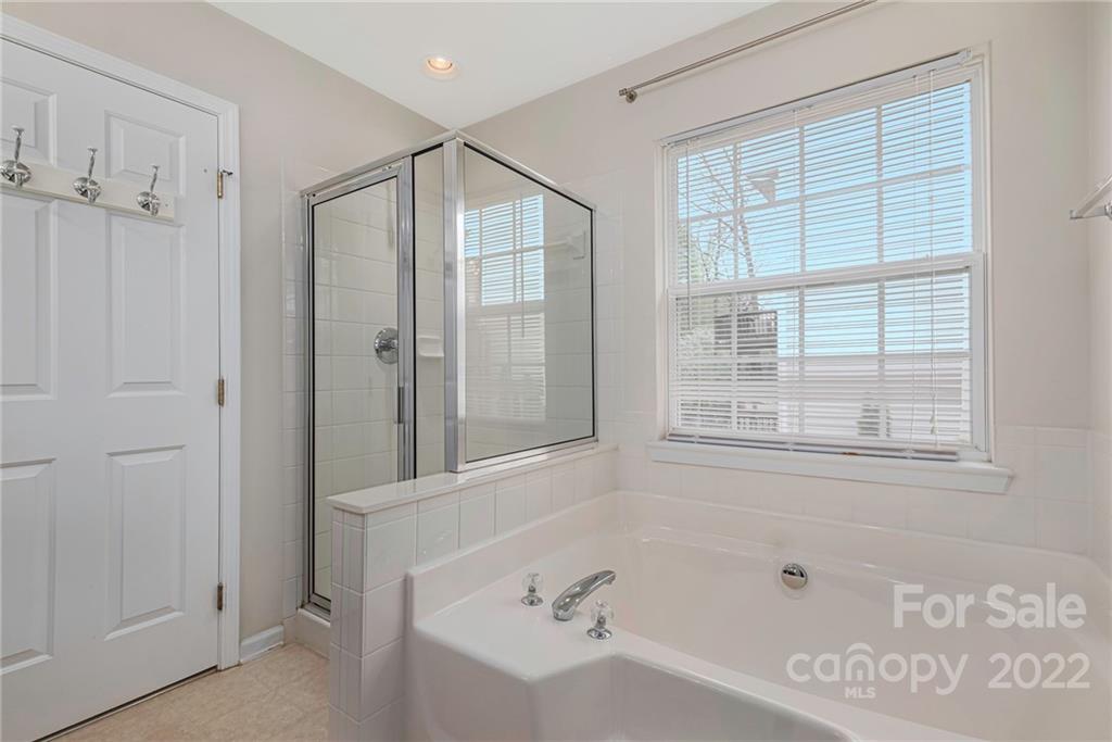237 Hyde Park Lane Fort Mill, SC 29708 - Photo 24 of 34 a bathroom with a bathtub and a shower