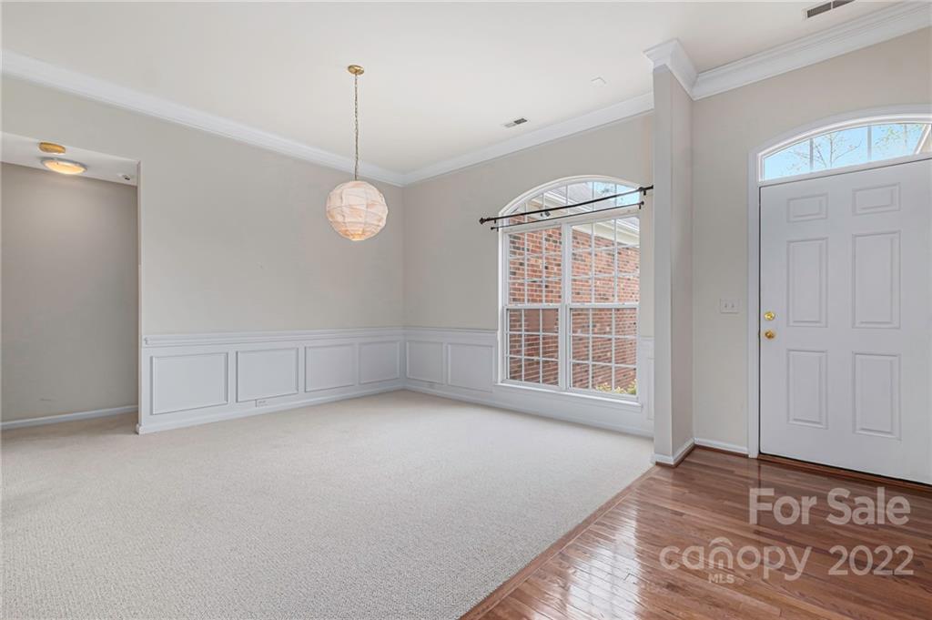 237 Hyde Park Lane Fort Mill, SC 29708 - Photo 8 of 34 a view of an empty room with a window and hardwood floor