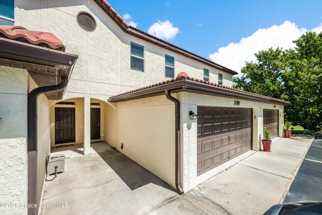 a kitchen with granite countertop stainless steel appliances a sink cabinets and a window