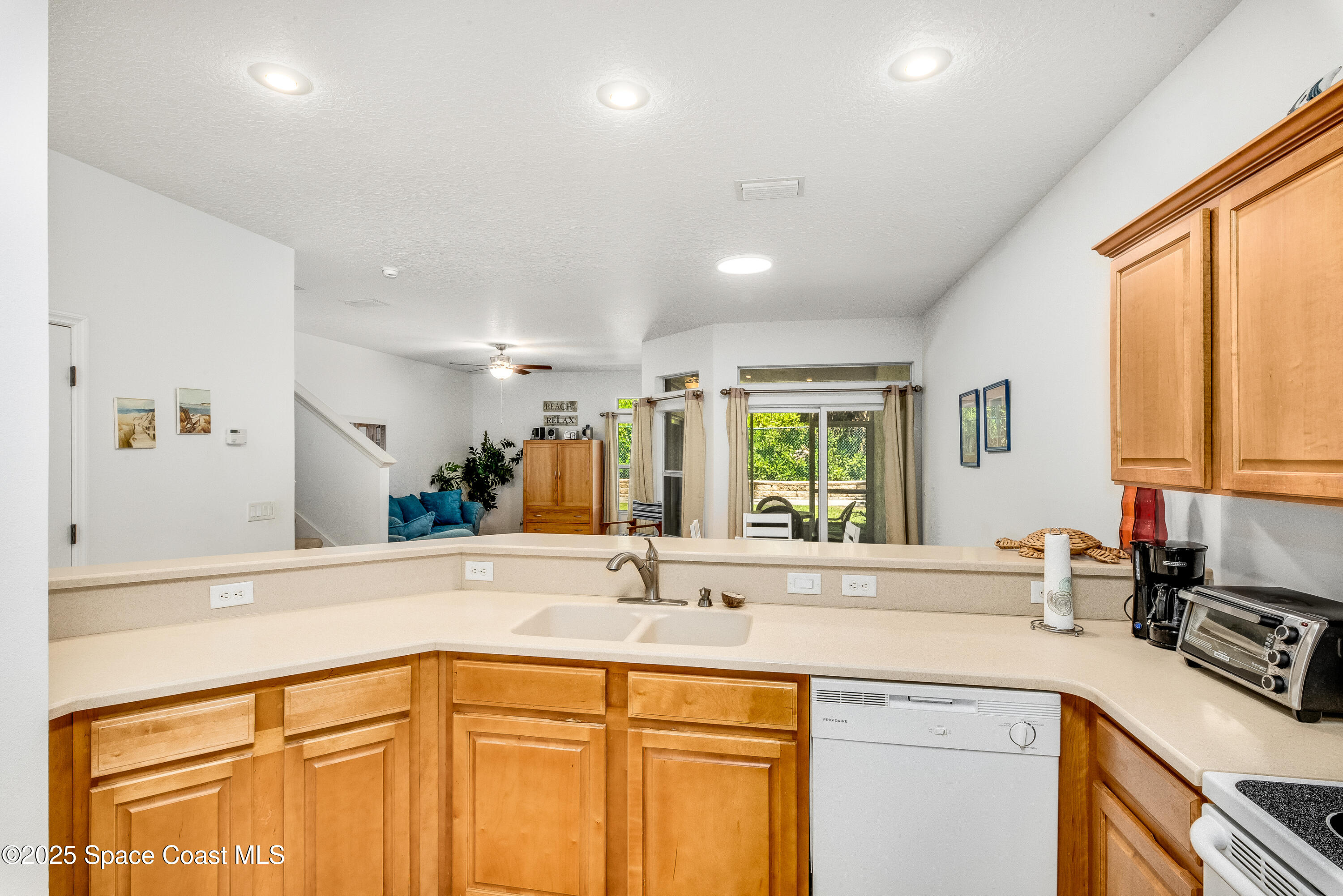 3188 Ricks Way, Unit B Melbourne Beach, FL 32951 - Photo 11 of 58 a view of a sink and a large mirror in a room