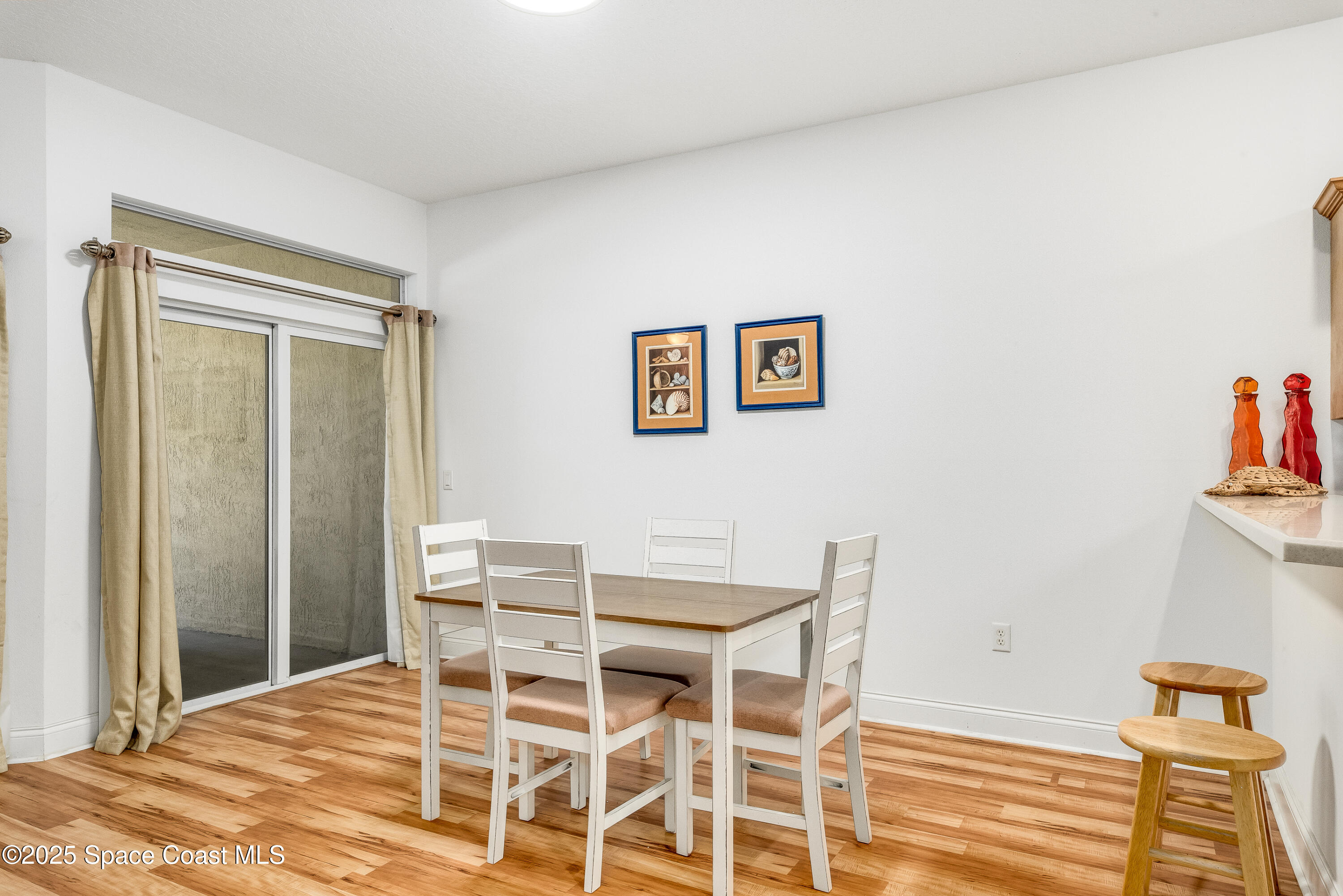 3188 Ricks Way, Unit B Melbourne Beach, FL 32951 - Photo 14 of 58 a dining room with a table and chairs