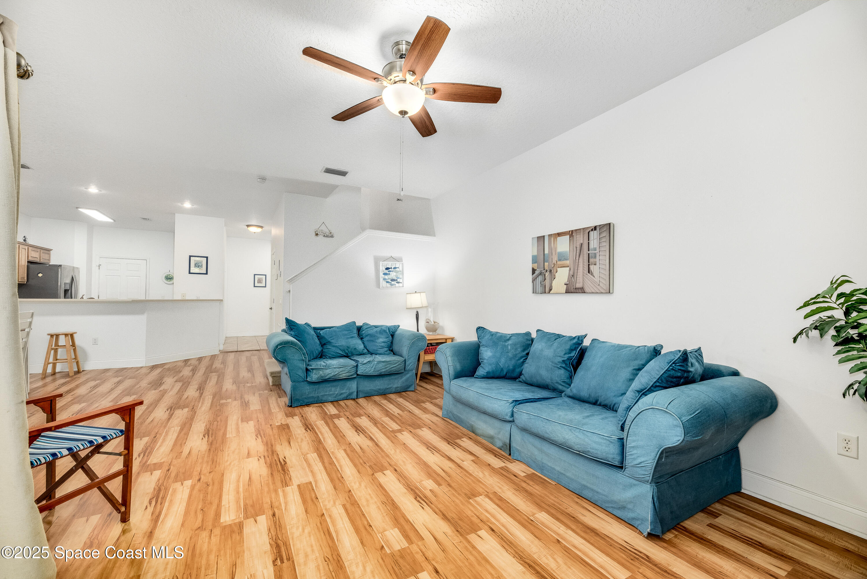 3188 Ricks Way, Unit B Melbourne Beach, FL 32951 - Photo 17 of 58 a living room with furniture and a wooden floor