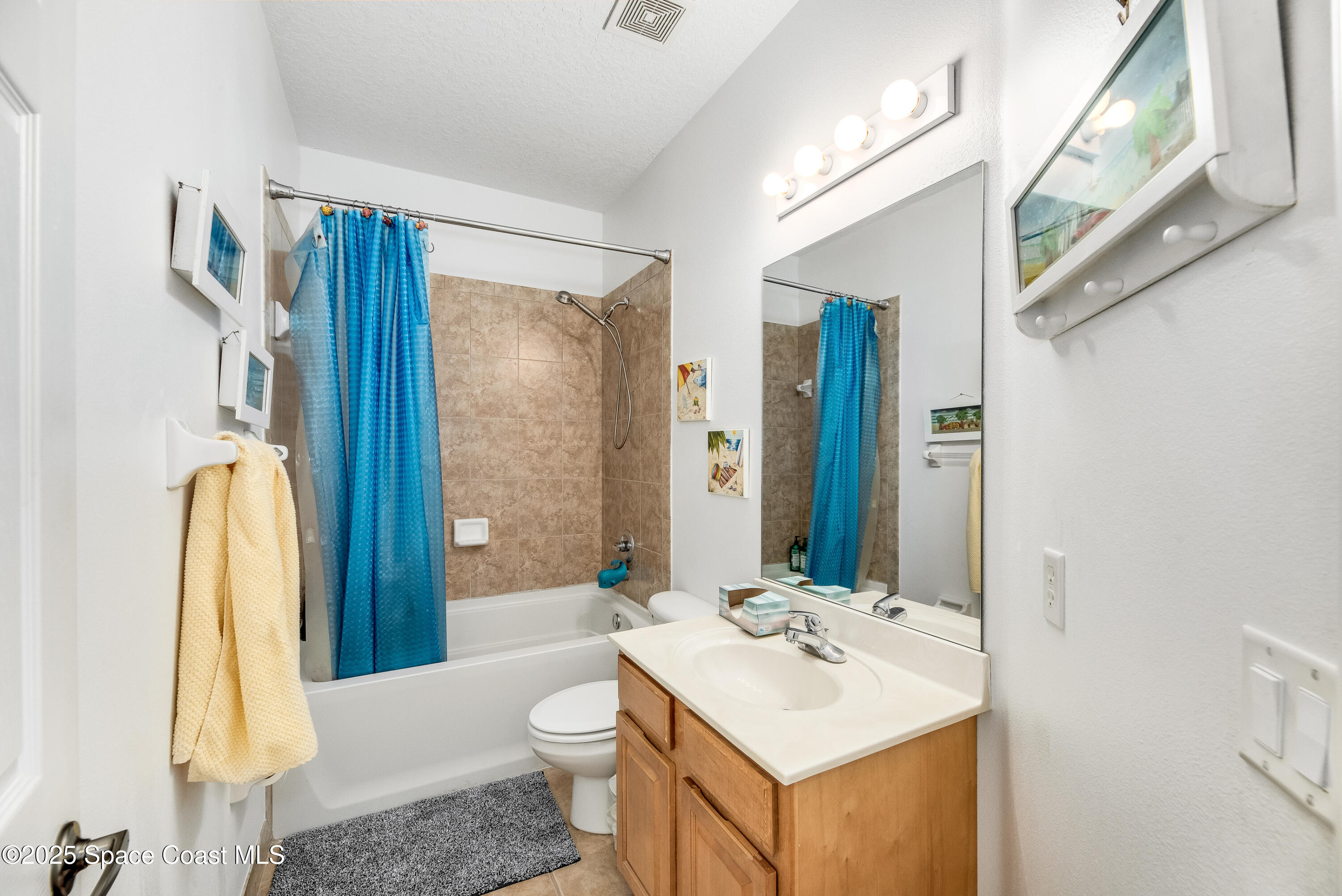 3188 Ricks Way, Unit B Melbourne Beach, FL 32951 - Photo 24 of 58 a bathroom with a sink toilet and shower