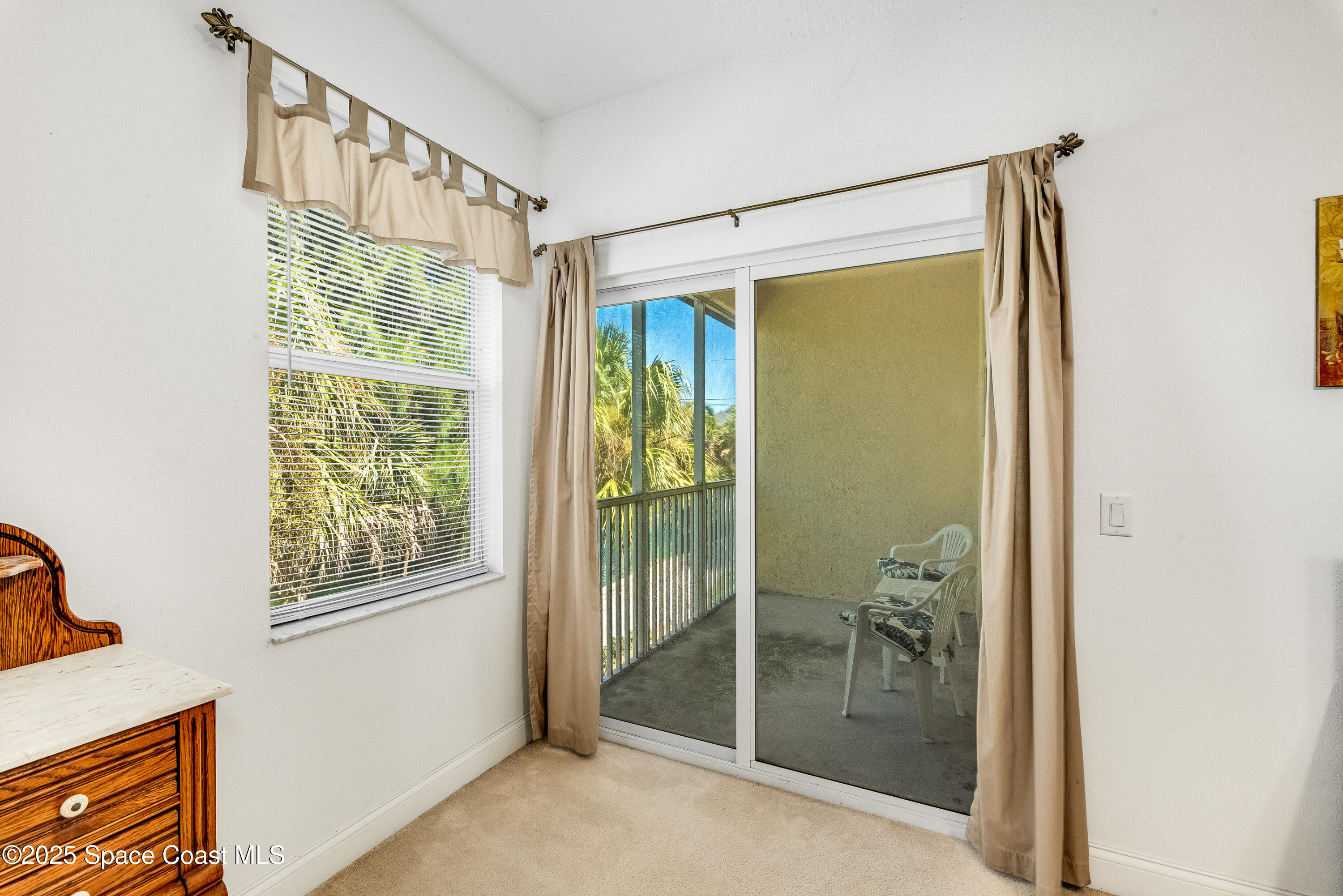 3188 Ricks Way, Unit B Melbourne Beach, FL 32951 - Photo 28 of 58 a bathroom with a glass shower door