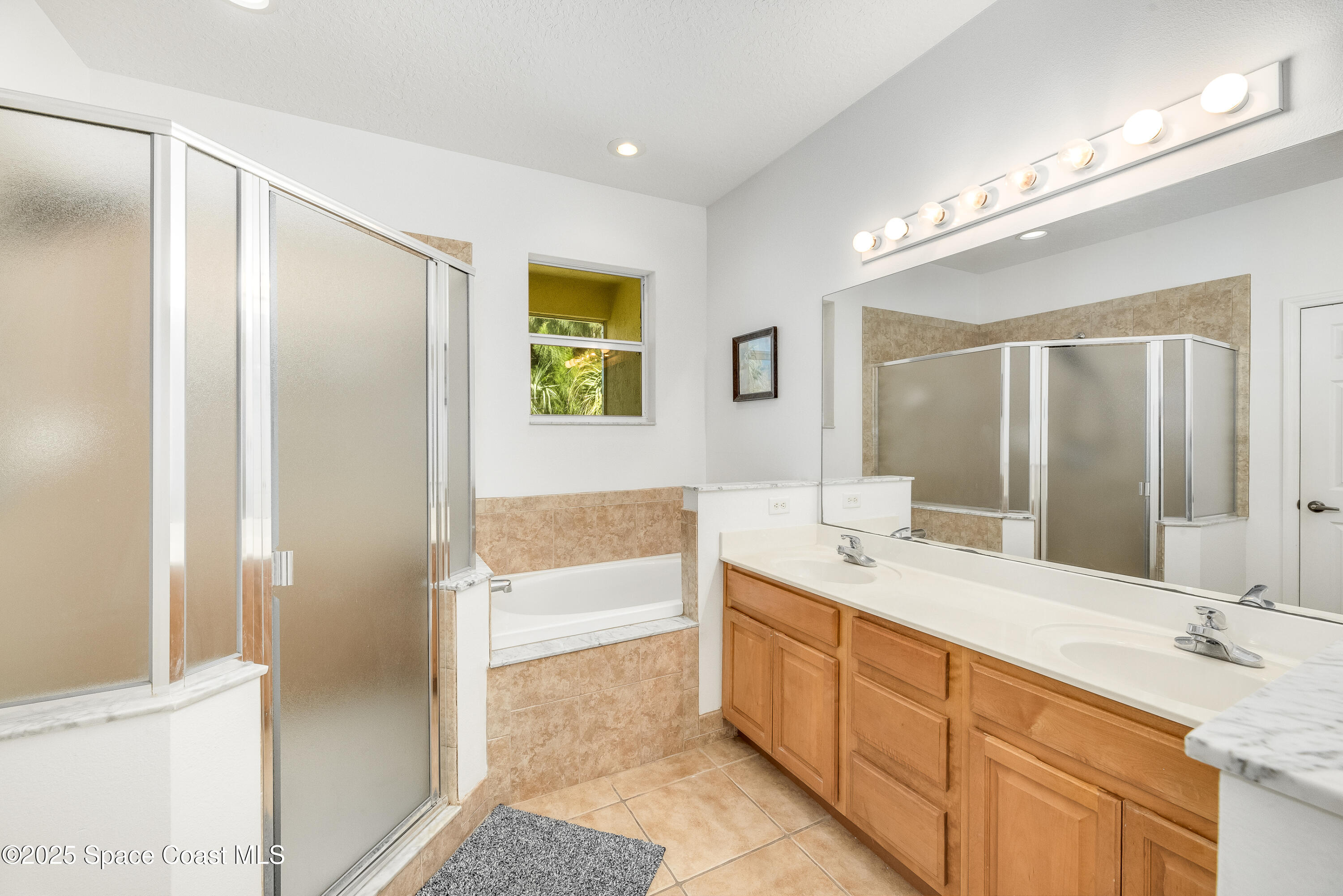 3188 Ricks Way, Unit B Melbourne Beach, FL 32951 - Photo 29 of 58 a bathroom with a granite countertop sink mirror and a