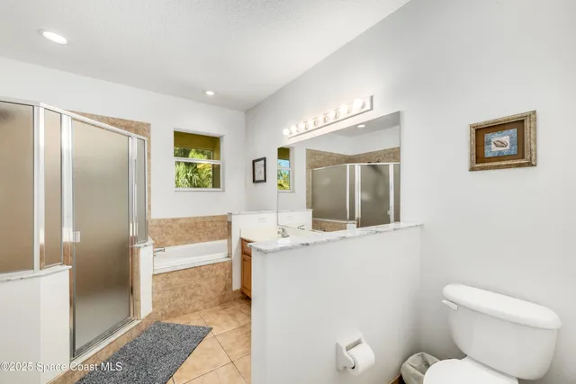 a view of a room with a table and chairs