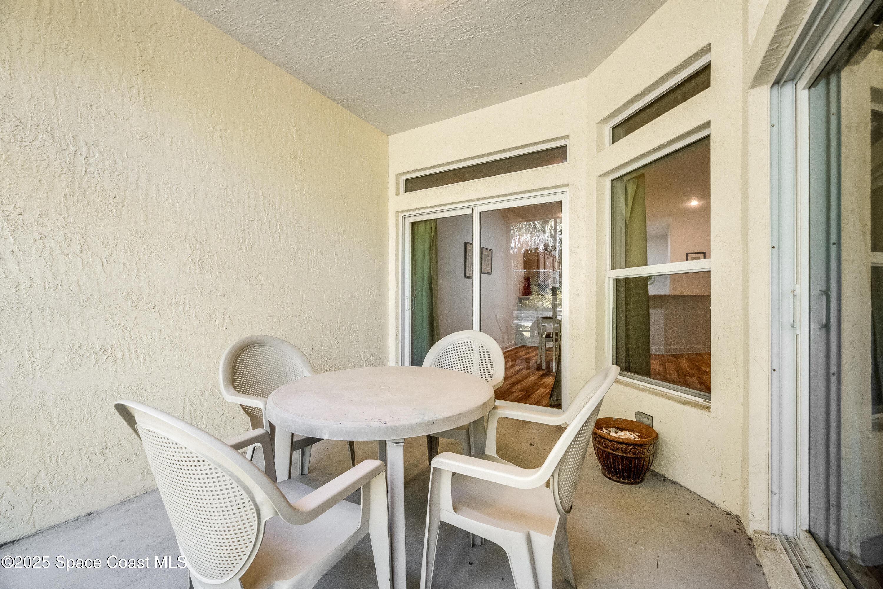 3188 Ricks Way, Unit B Melbourne Beach, FL 32951 - Photo 33 of 58 a view of a room with a table and chairs