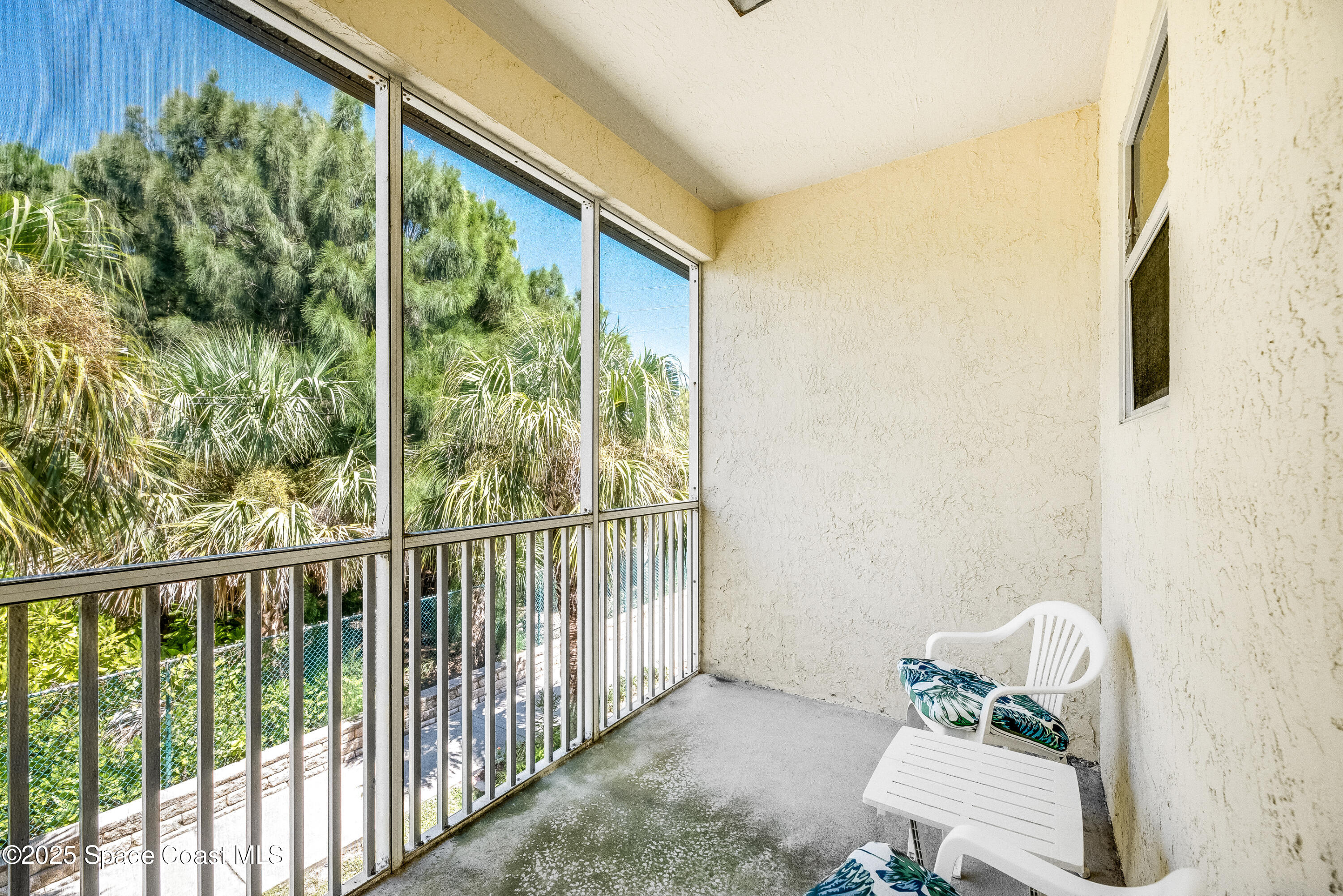 3188 Ricks Way, Unit B Melbourne Beach, FL 32951 - Photo 35 of 58 a view of a porch with furniture