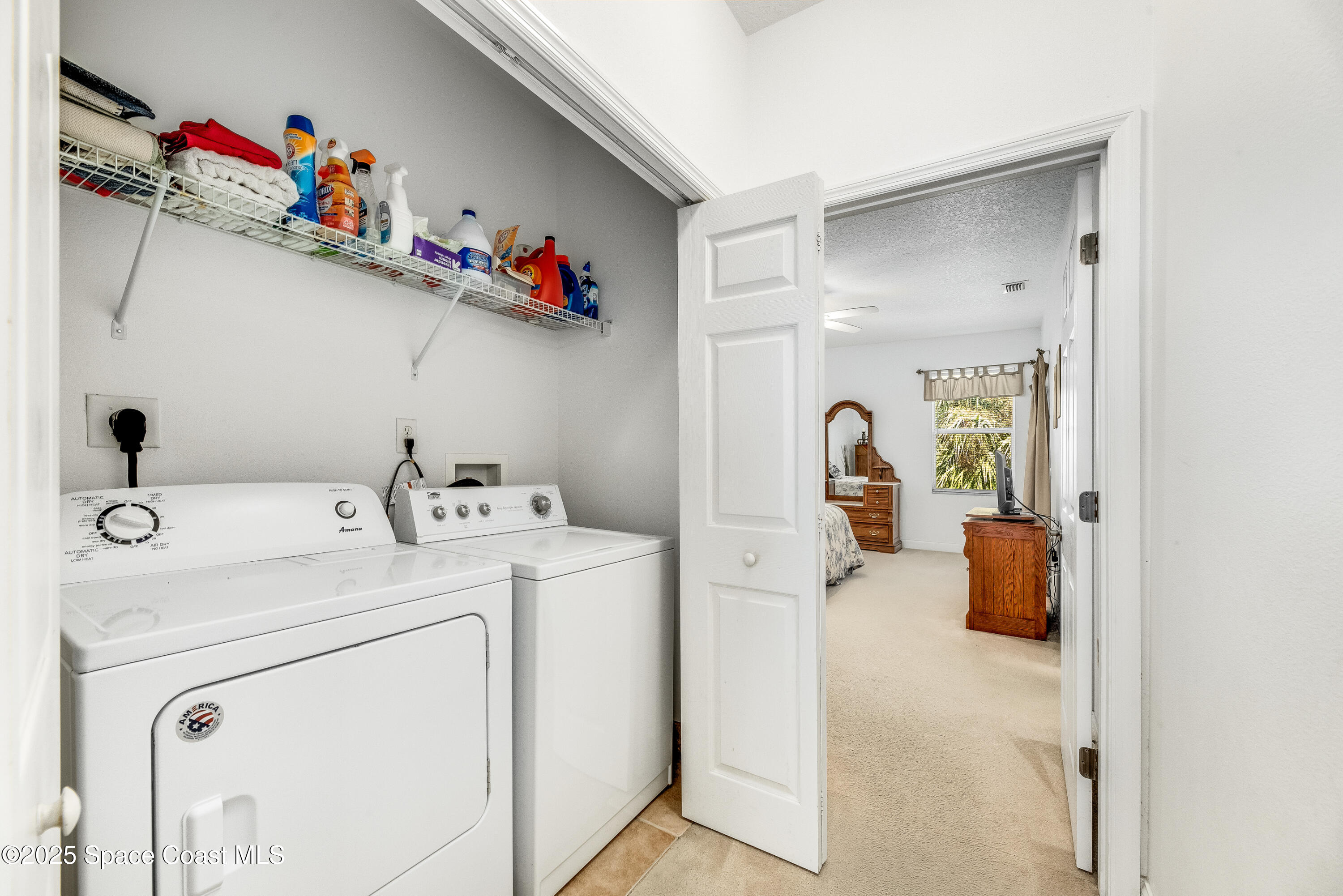 3188 Ricks Way, Unit B Melbourne Beach, FL 32951 - Photo 36 of 58 a utility room with dryer and washer