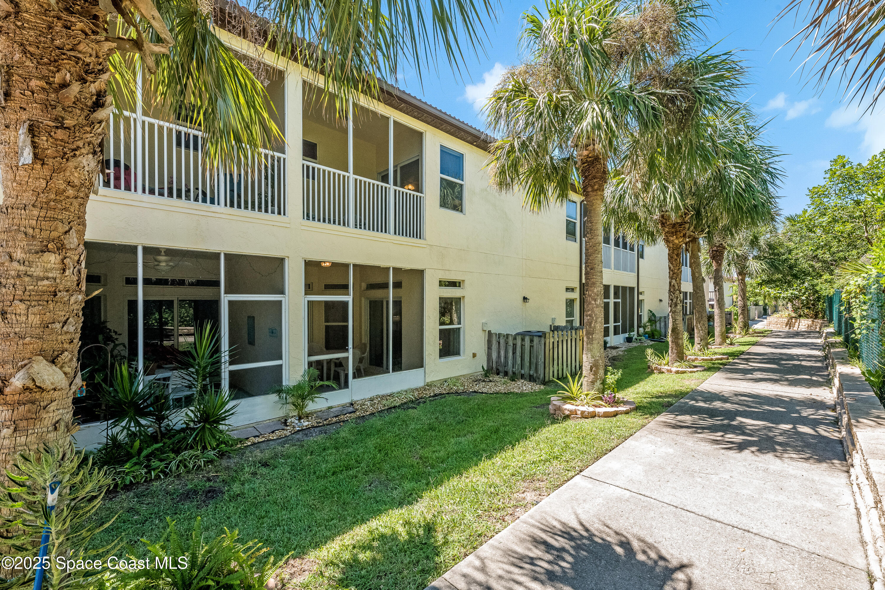 3188 Ricks Way, Unit B Melbourne Beach, FL 32951 - Photo 50 of 58 a view of a house with a yard and plants