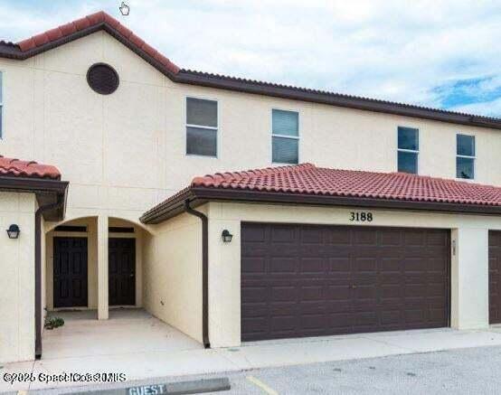 3188 Ricks Way, Unit B Melbourne Beach, FL 32951 - Photo 53 of 58 a view of a house with a garage