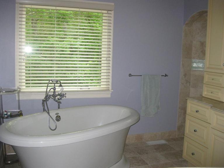 7 Aunt Janes Road Mashpee, MA 02649 - Photo 12 of 14 a bathroom with a bathtub and a window