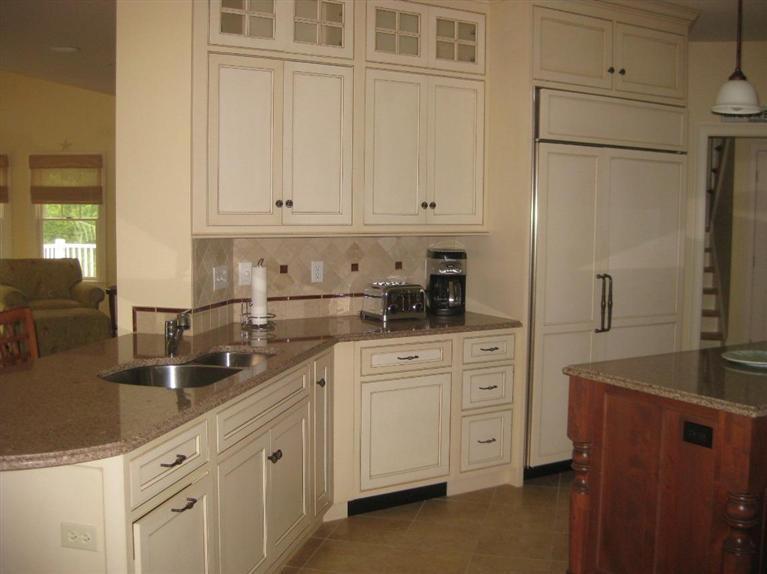 7 Aunt Janes Road Mashpee, MA 02649 - Photo 6 of 14 a kitchen with stainless steel appliances granite countertop white cabinets and a refrigerator a sink