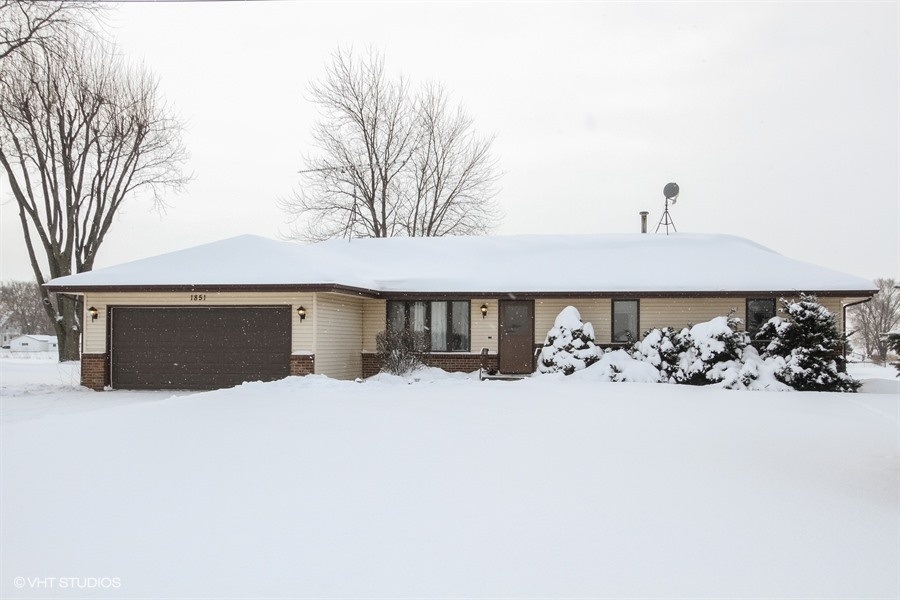 1851 Ipsen Road Belvidere, IL 61008 - Photo 2 of 14 a front view of a house with yard