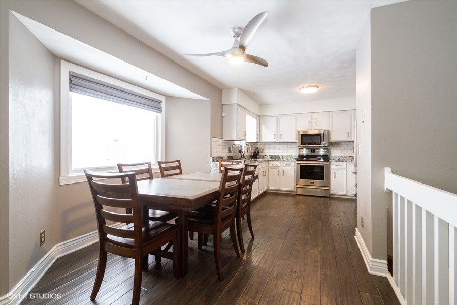 1851 Ipsen Road Belvidere, IL 61008 - Photo 8 of 14 a view of a dining room with furniture window and wooden floor