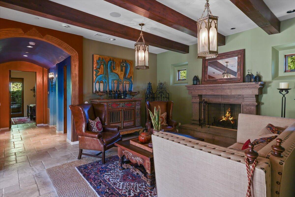 270 West Overlook Road Palm Springs, CA 92264 - Photo 12 of 44 a living room with furniture a fireplace and a table