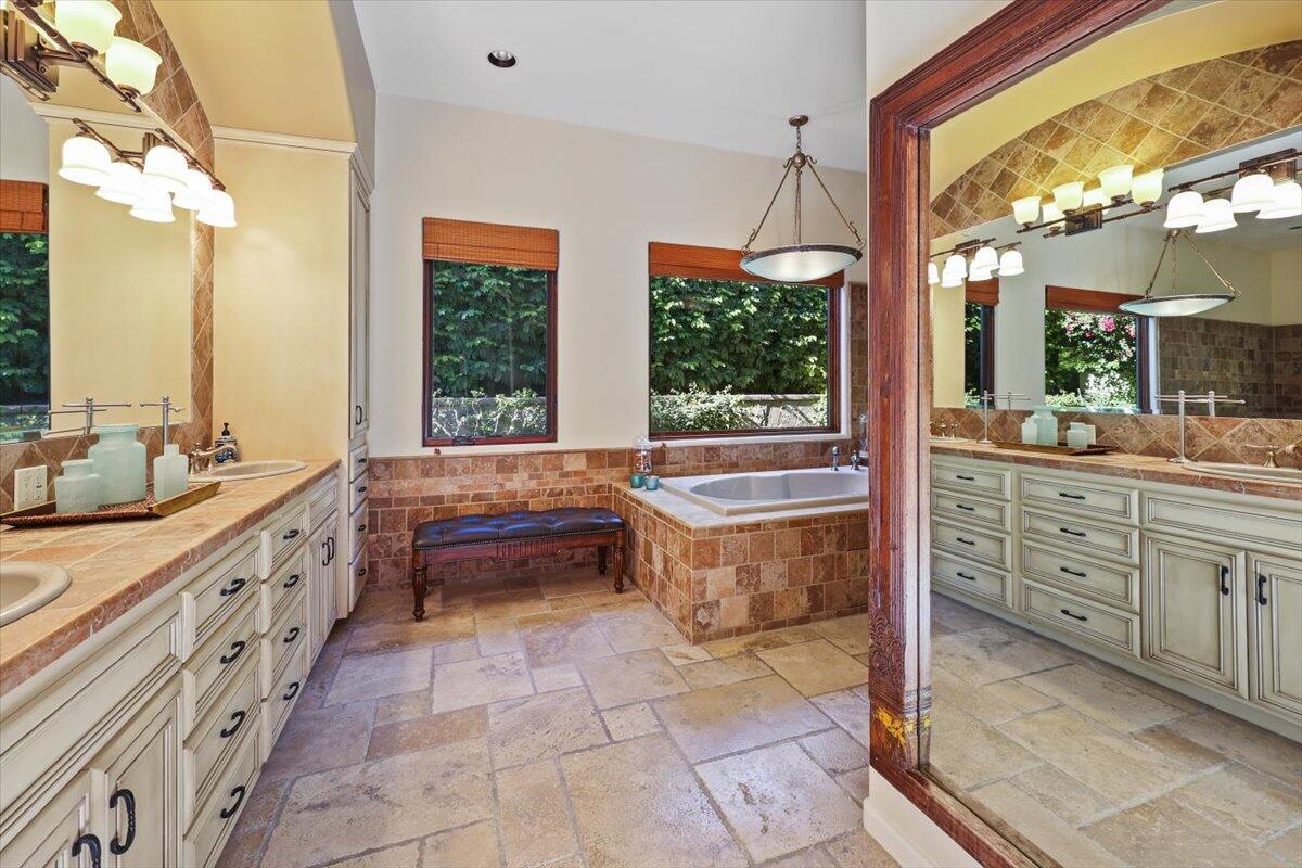 270 West Overlook Road Palm Springs, CA 92264 - Photo 21 of 44 a bathroom with a granite countertop sink mirror and a bathtub