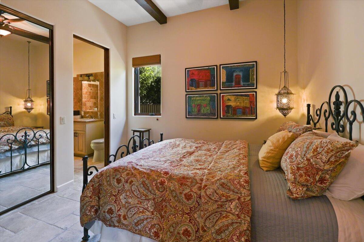 270 West Overlook Road Palm Springs, CA 92264 - Photo 28 of 44 a bedroom with a bed and wooden floor