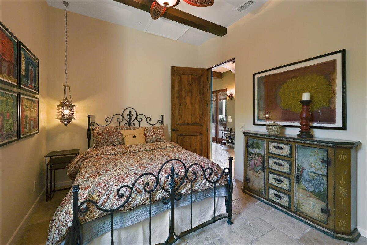 270 West Overlook Road Palm Springs, CA 92264 - Photo 29 of 44 a bedroom with a bed a dresser and potted plants on the table