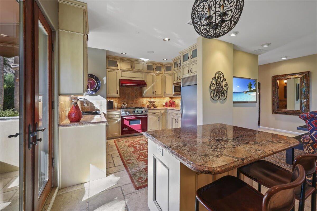 270 West Overlook Road Palm Springs, CA 92264 - Photo 9 of 44 a view of kitchen island with granite countertop living room