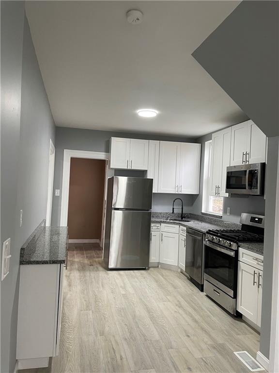 1232 Clairhaven Street Pittsburgh, PA 15205 - Photo 12 of 29 a kitchen with a refrigerator a stove top oven a sink and dishwasher