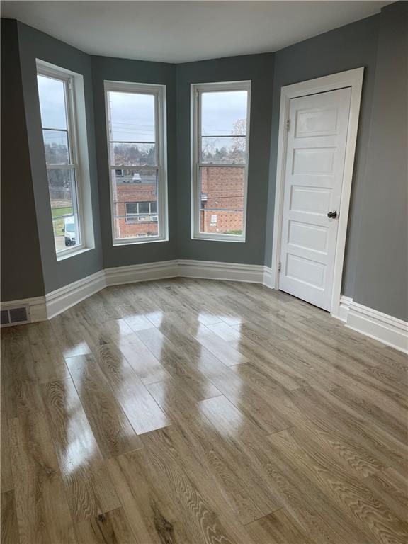 1232 Clairhaven Street Pittsburgh, PA 15205 - Photo 19 of 29 an empty room with wooden floor and windows