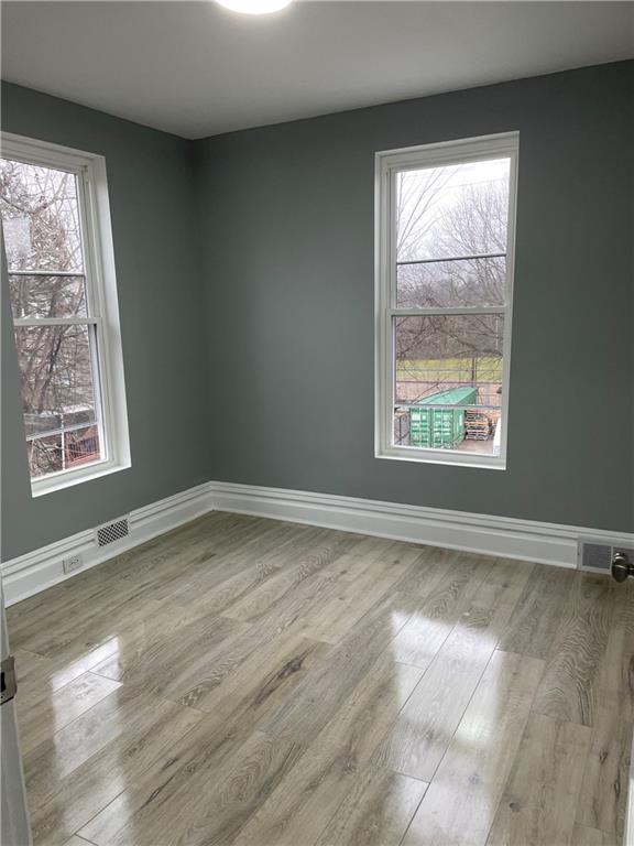 1232 Clairhaven Street Pittsburgh, PA 15205 - Photo 20 of 29 an empty room with wooden floor and windows