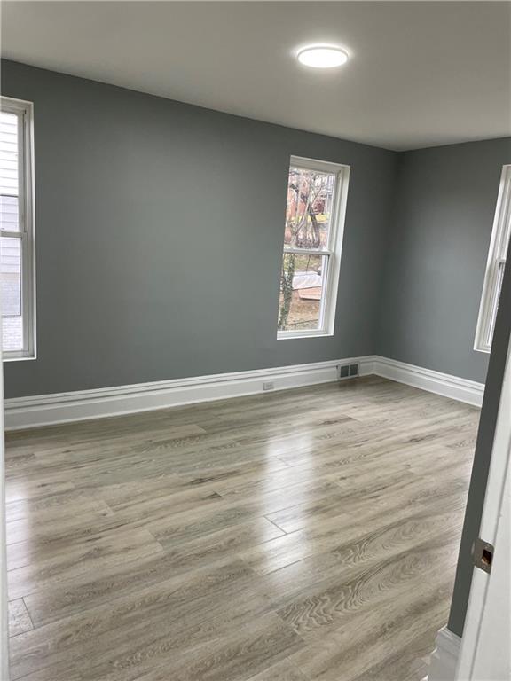 1232 Clairhaven Street Pittsburgh, PA 15205 - Photo 22 of 29 an empty room with wooden floor and windows