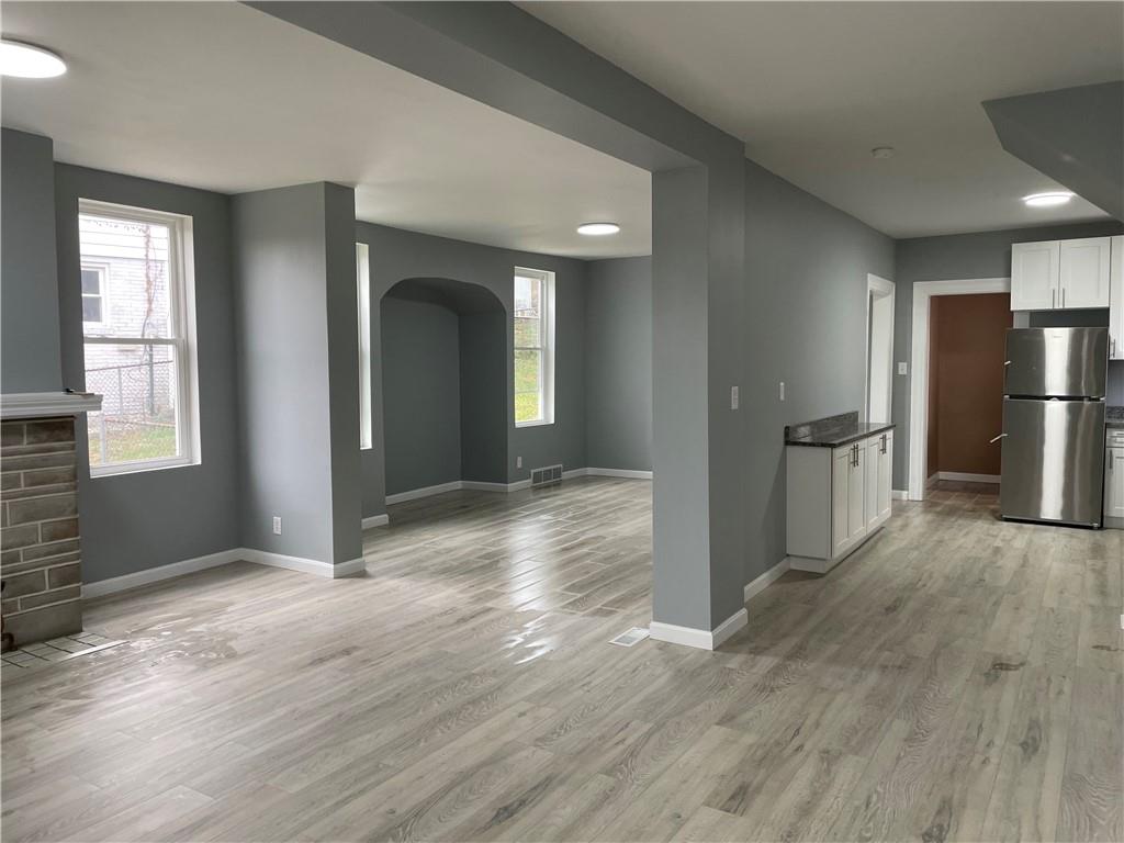1232 Clairhaven Street Pittsburgh, PA 15205 - Photo 10 of 29 a view of a kitchen with wooden floor and a refrigerator